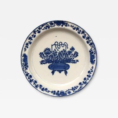 Early 18th century Dutch Delft plate with flower basket design