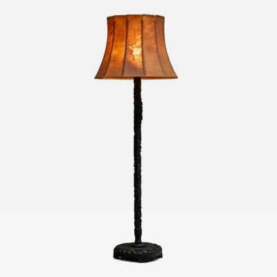 Early 20th Century Floor Lamp in Hand Carved Wood with Stunning Leather Shade