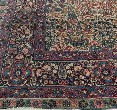 Early 20th Century Persian Kirman Wool Rug in Blue Brown Green Pink and Red