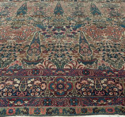 Early 20th Century Persian Kirman Wool Rug in Blue Brown Green Pink and Red
