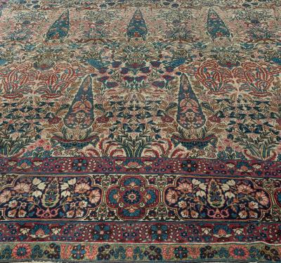 Early 20th Century Persian Kirman Wool Rug in Blue Brown Green Pink and Red