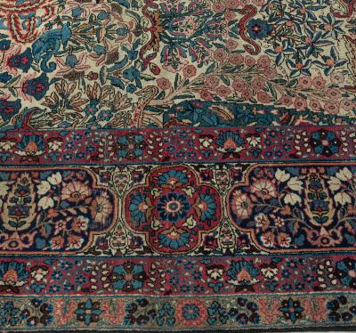 Early 20th Century Persian Kirman Wool Rug in Blue Brown Green Pink and Red