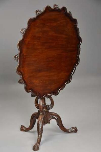 Early 20thc mahogany tilt top tripod table in the Chippendale style