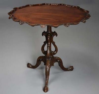 Early 20thc mahogany tilt top tripod table in the Chippendale style
