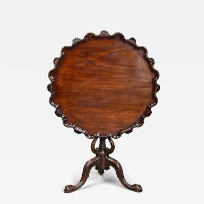 Early 20thc mahogany tilt top tripod table in the Chippendale style
