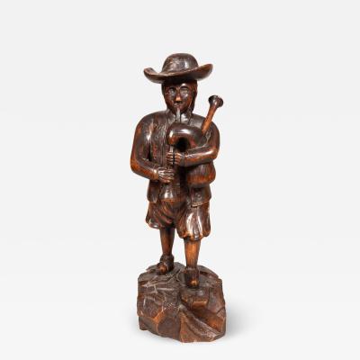 Early Victorian Carving Of A Bagpiper