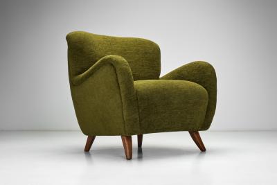 Easy Chair with Angled Beech Legs and Deep Green Upholstery Europe 1940s