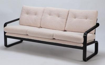 Ebonized French three seat sofa recently upholstered in Boucle fabric