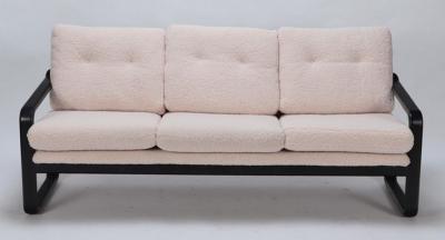 Ebonized French three seat sofa recently upholstered in Boucle fabric