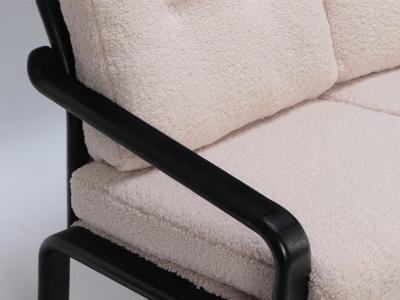 Ebonized French three seat sofa recently upholstered in Boucle fabric