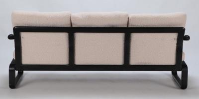 Ebonized French three seat sofa recently upholstered in Boucle fabric