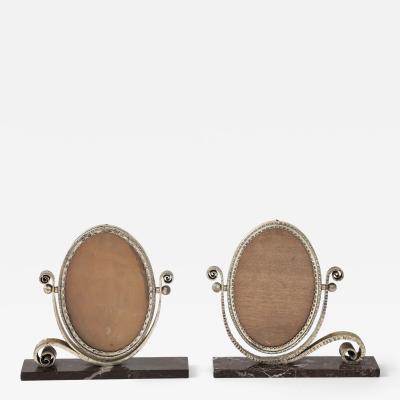 Edgar Brandt Pair of Edgar Brandt Style Art Deco Silvered Mirror Frames on Marble Bases