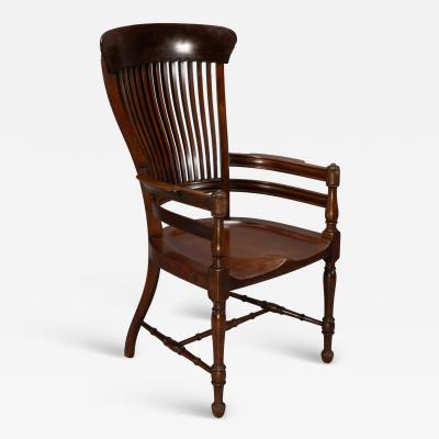 Edward William Godwin E W Godwin Attributed A tall back serpentine shape Walnut Armchair