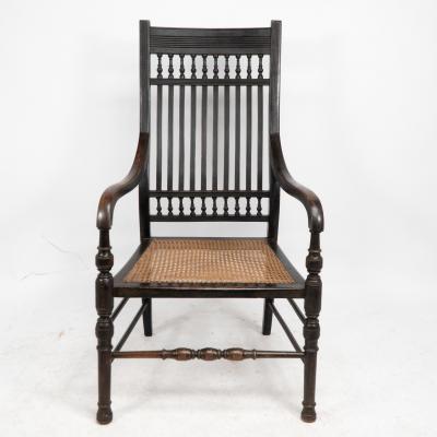 Edward William Godwin E W Godwin for William Watt An Aesthetic Movement tall back ebonized armchair 