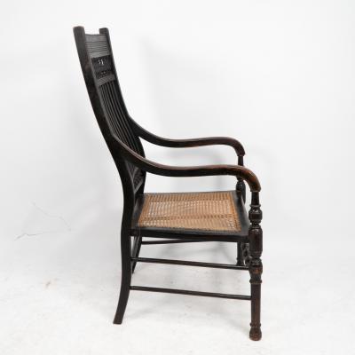 Edward William Godwin E W Godwin for William Watt An Aesthetic Movement tall back ebonized armchair 