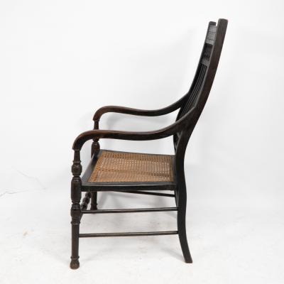 Edward William Godwin E W Godwin for William Watt An Aesthetic Movement tall back ebonized armchair 