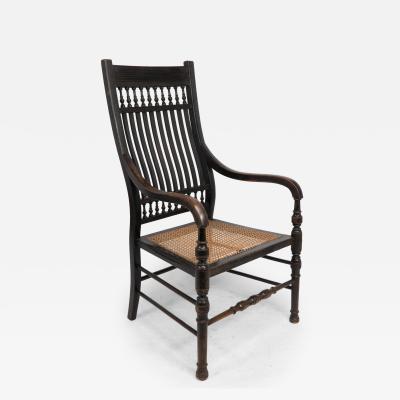 Edward William Godwin E W Godwin for William Watt An Aesthetic Movement tall back ebonized armchair 