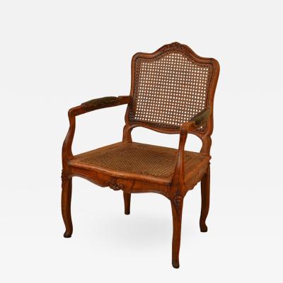 Elegant Caned Louis XV Period Walnut Armchair
