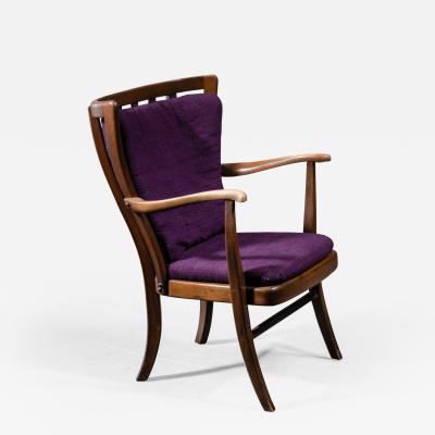 Elegant Danish Wingback Armchair with Warm Deep Purple Cushions