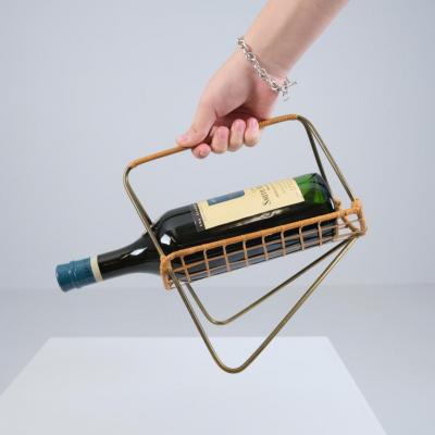 Elegant Scandinavian Mid Century Wine Bottle Holder in Brass and Rattan 1950s