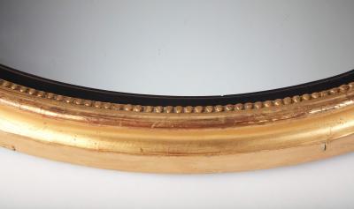 English George III Giltwood and Ebonized Frame Convex Mirror circa 1800