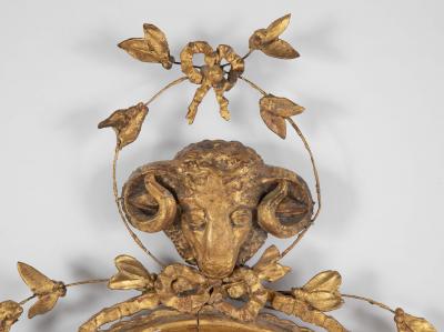English George III Oval Hepplewhite Gilded Mirror with Rams Head Surmount