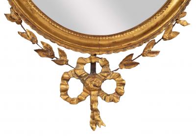 English George III Oval Hepplewhite Gilded Mirror with Rams Head Surmount
