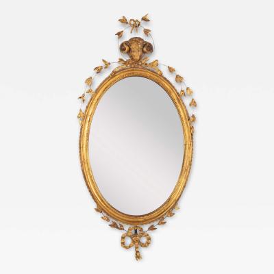 English George III Oval Hepplewhite Gilded Mirror with Rams Head Surmount