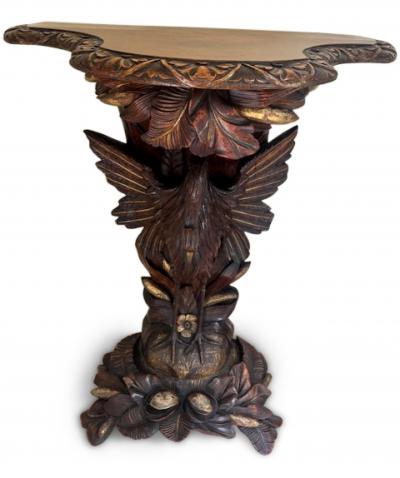 English Regency console with a carved bird floral base over a shaped top