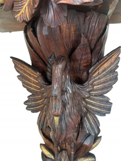 English Regency console with a carved bird floral base over a shaped top