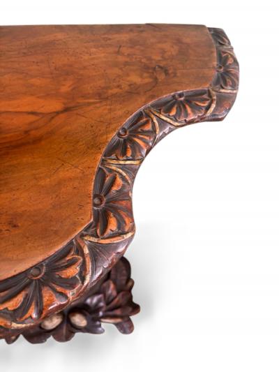 English Regency console with a carved bird floral base over a shaped top