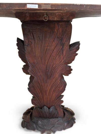 English Regency console with a carved bird floral base over a shaped top