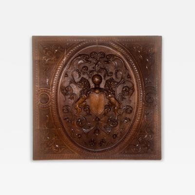 English Renaissance style square wall plaque with carved coat of arms