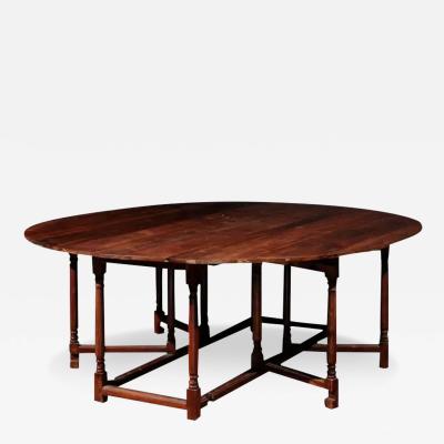 English Walnut Oval Top Drop Leaf Gateleg Table with Turned Legs and Stretchers