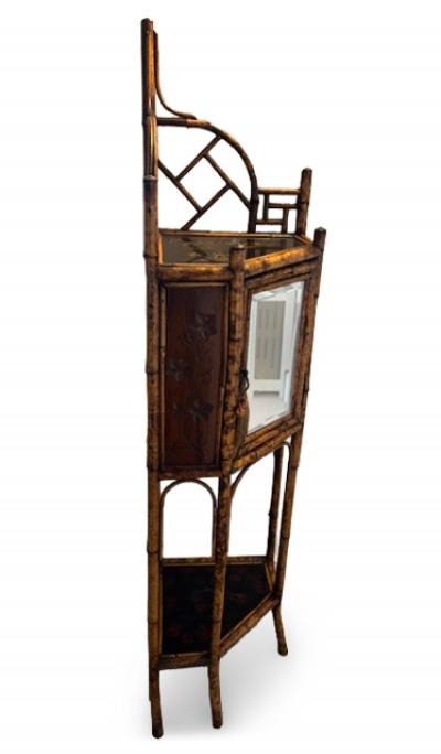 English bamboo corner cabinet with a front door and lacquered shelf