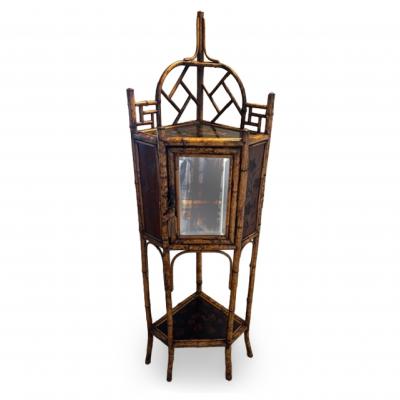 English bamboo corner cabinet with a front door and lacquered shelf
