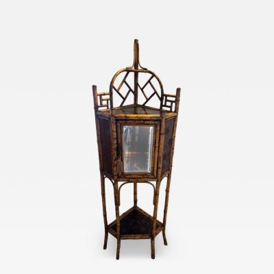 English bamboo corner cabinet with a front door and lacquered shelf