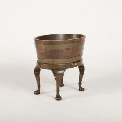 English oval oak planter or wine cooler with brass braces and tin liner on stand