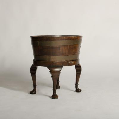 English oval oak planter or wine cooler with brass braces and tin liner on stand