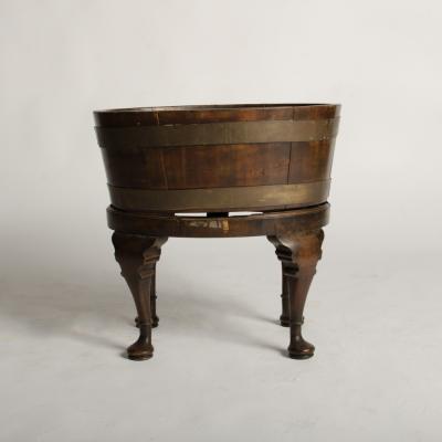 English oval oak planter or wine cooler with brass braces and tin liner on stand