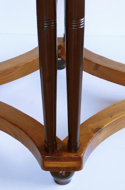 English pine oval center side table raised on columnar supports