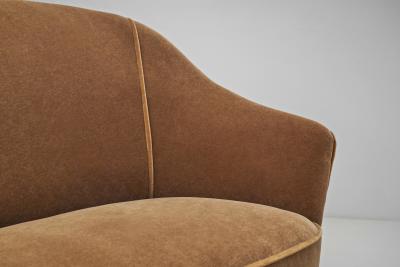 European Upholstered Three Seater Sofa with Stained Wood Legs Europe ca 1960s