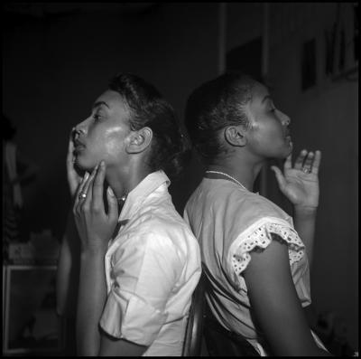 Eve Arnold Two young models check their make up