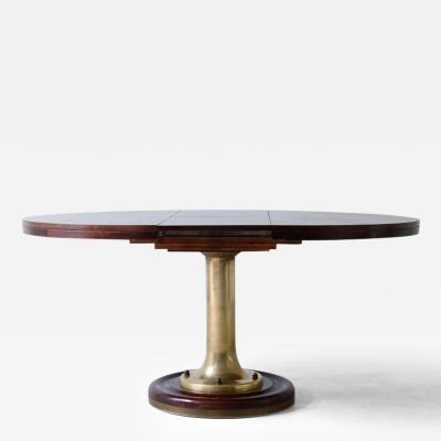 Extendable ships table with cast bronze column mahogany base and top 