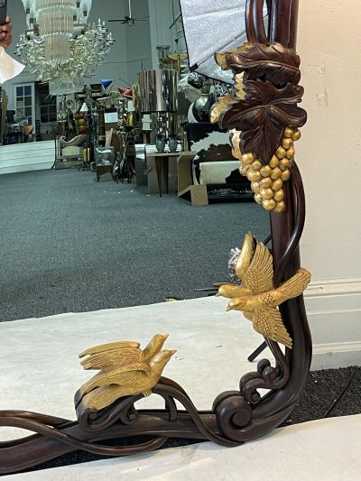 FANTASTICAL CARVED ART NOUVEAU MIRROR WITH GILT GRAPES AND BIRDS