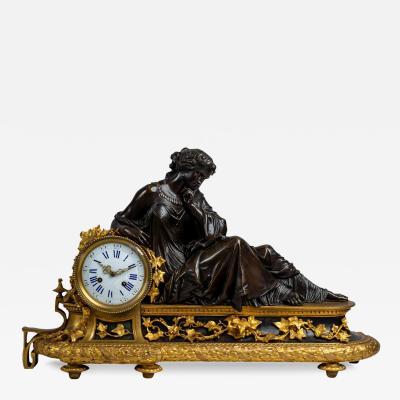 FRENCH ORMOLU AND PATINATED BRONZE MANTEL CLOCK DEPICTING CLEOPATRA