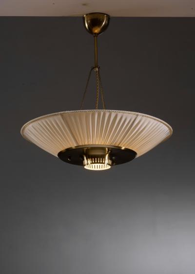 Fabric and brass pendant