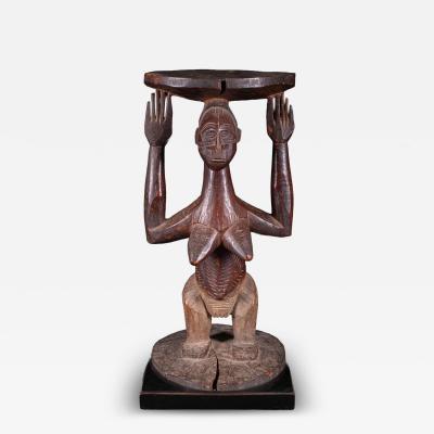 Female Caryatid standing Figure on a circular base supporting a circular stool