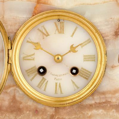 Ferdinand Barbedienne Antique patinated bronze and onyx mantel clock by Merci and Barbedienne