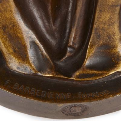 Ferdinand Barbedienne Two Orientalist patinated and gilt bronze figural torch res by Barbedienne